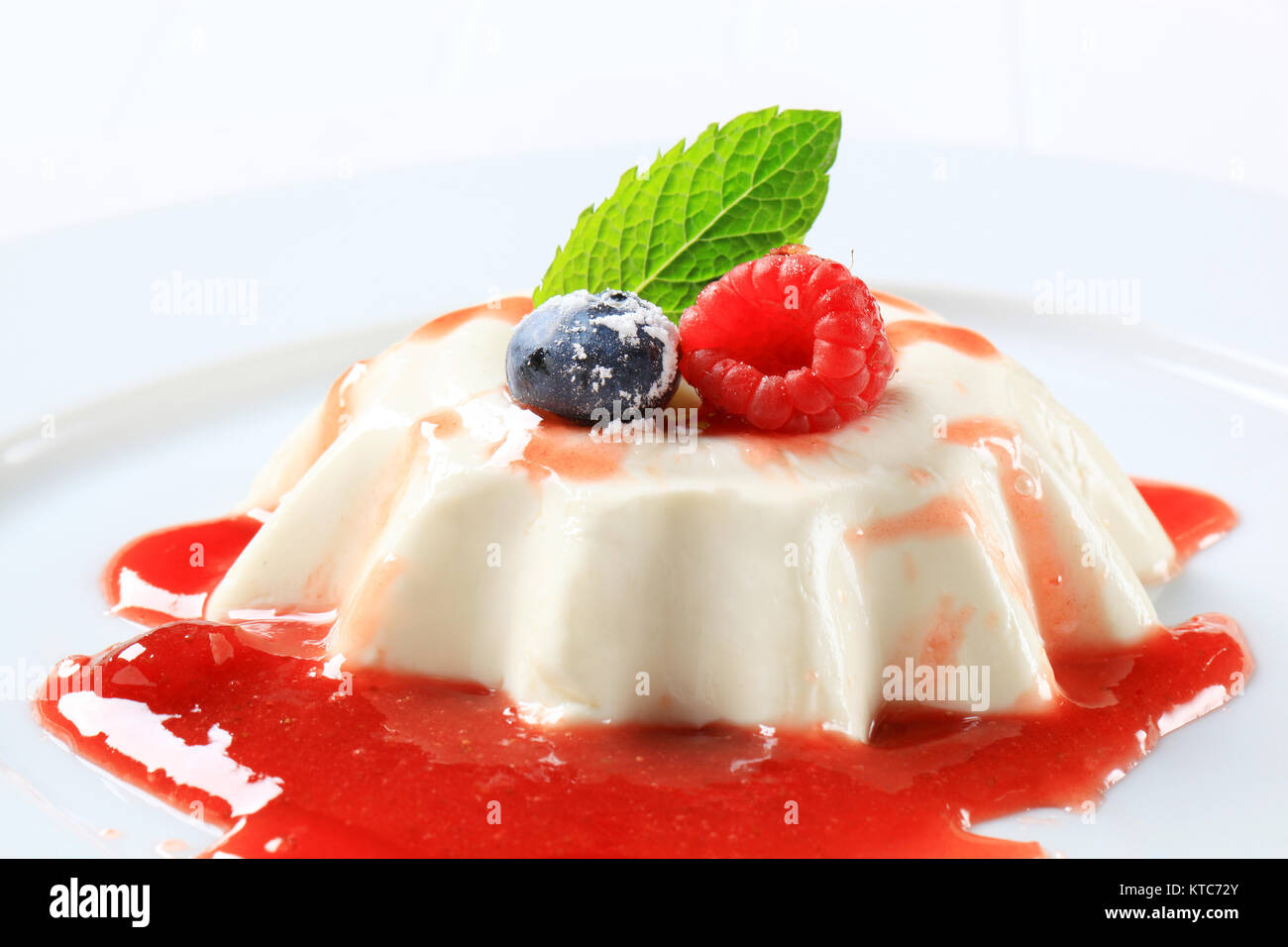 Panna cotta with strawberry sauce Stock Photo Alamy