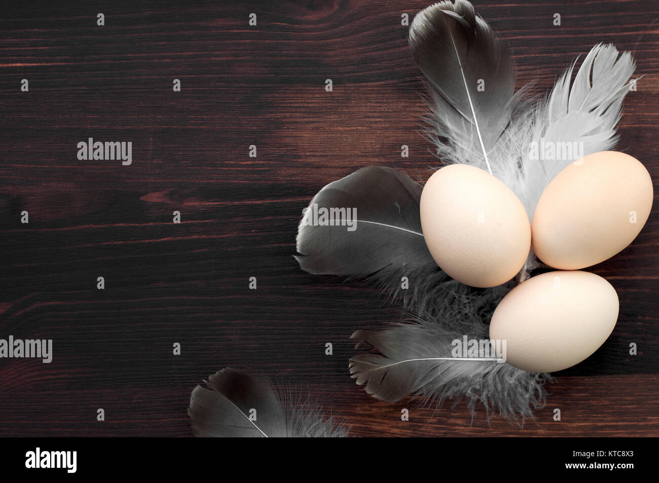 Chicken eggs on a brown wooden surface Stock Photo - Alamy