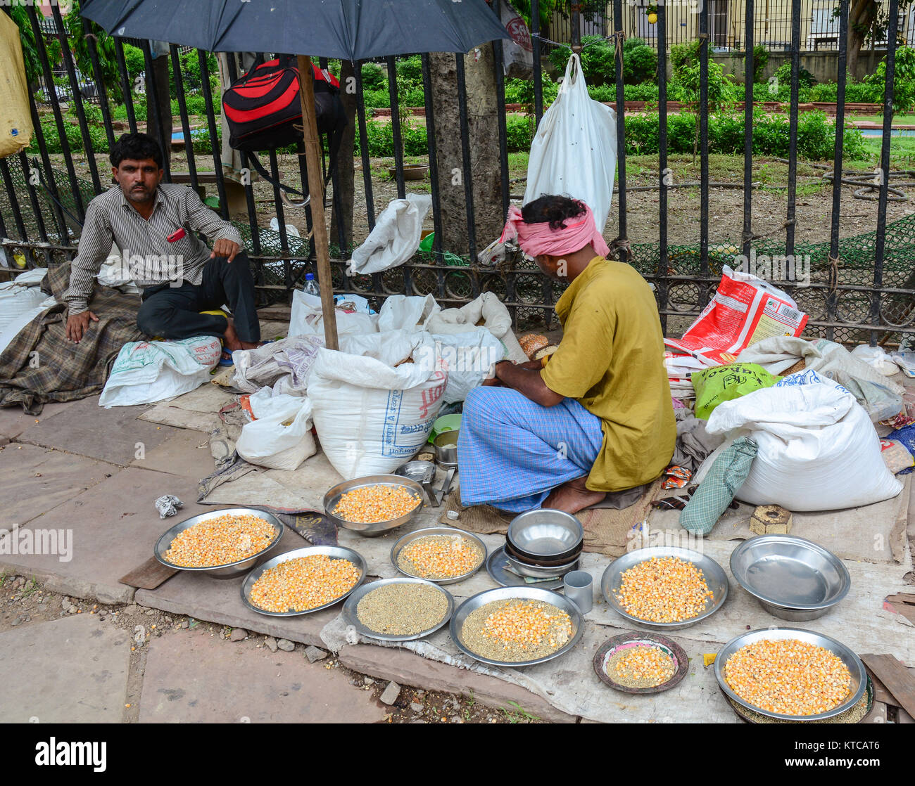 Delhi, India - Jul 26, 2015. People selling bird foods at the old market in Delhi, India. According to the 2011 census of India, the population of Del Stock Photo