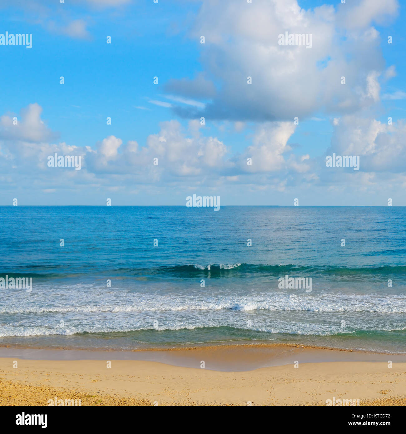 ocean, sandy beach and blue sky Stock Photo - Alamy