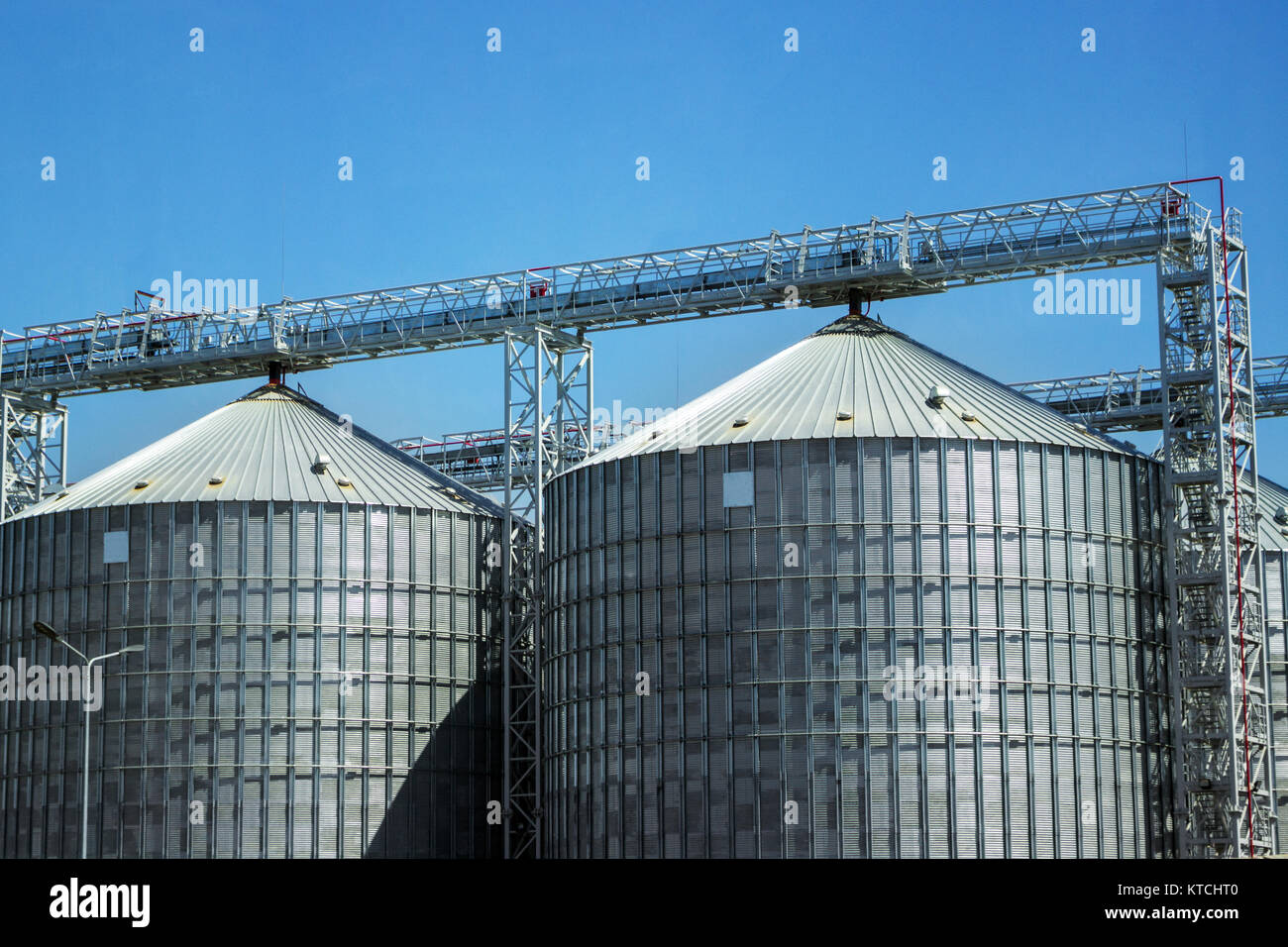 Industrial storage of raw materials in silos. Granary in the open sky ...