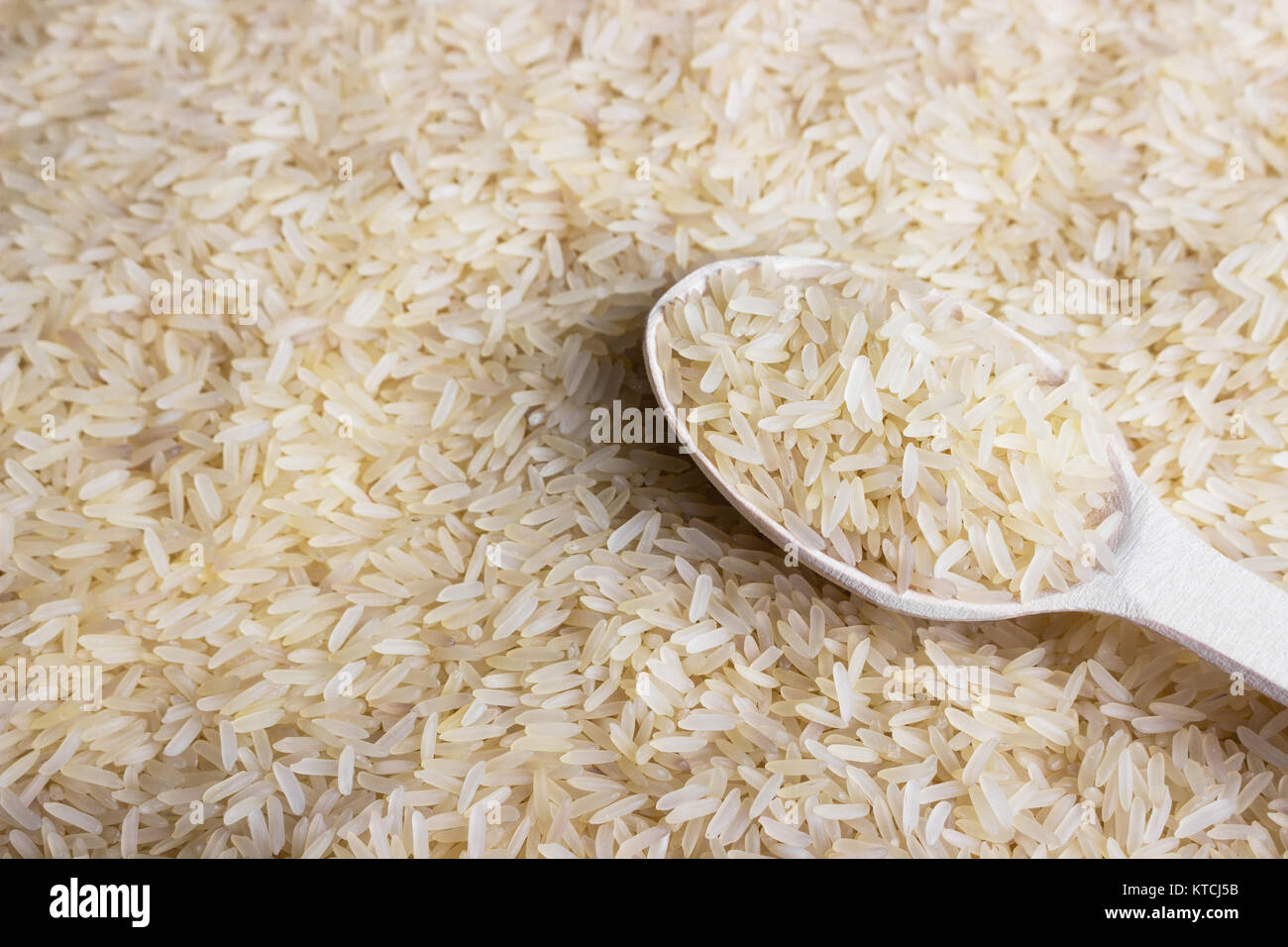 spoon with rice. Food background, rice background Stock Photo - Alamy