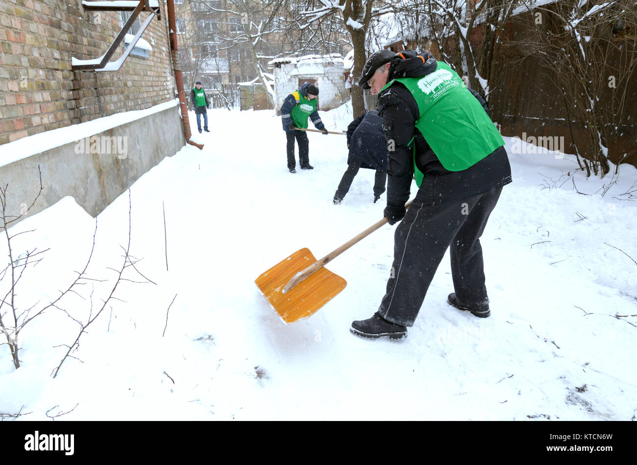 After blizzard. Municipal workers removing snow and ice from streets of Kyiv. January 12, 2016. Kyiv, Ukraine. Stock Photo