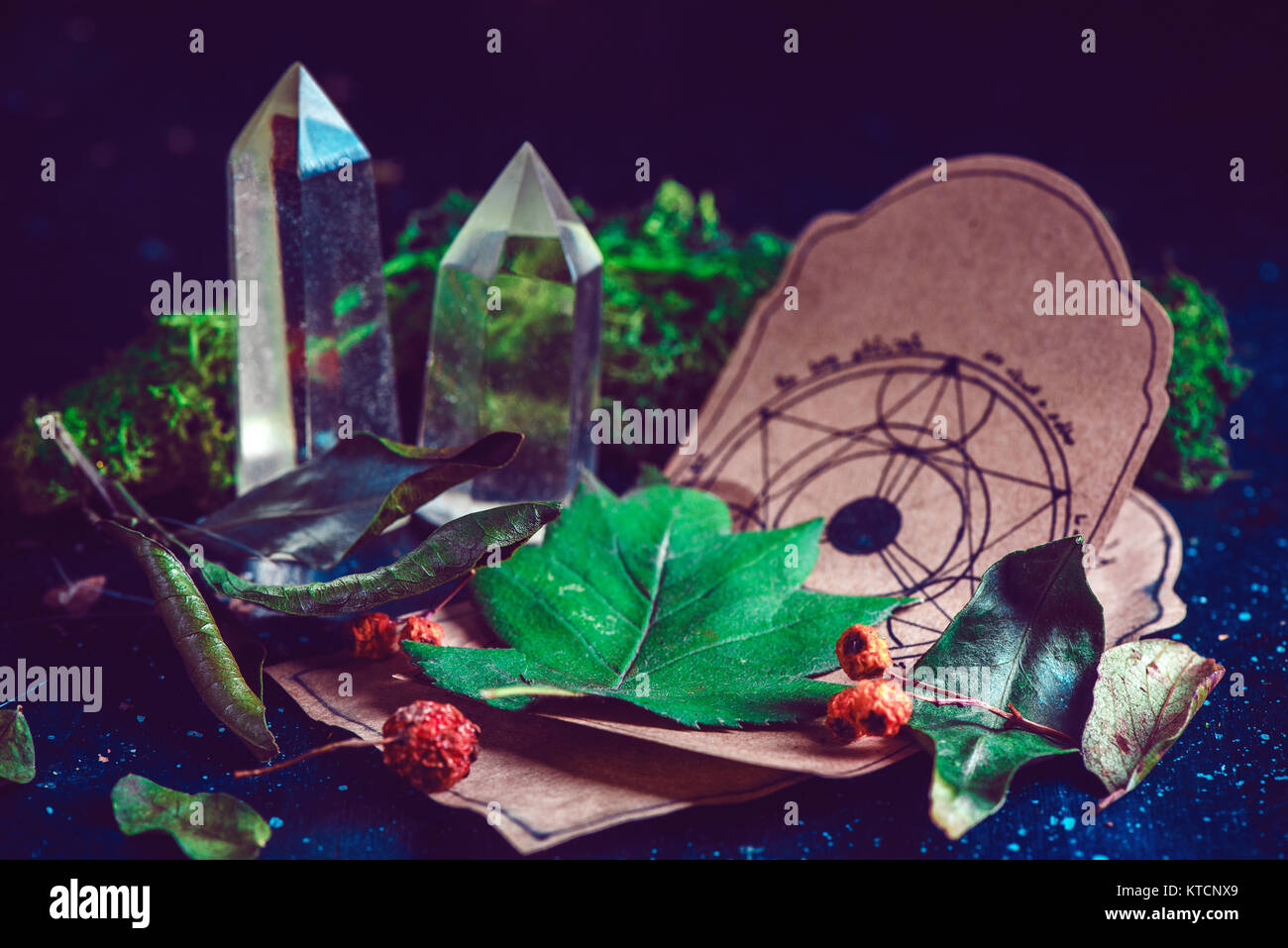 Pentagram drawing on a parchment with potion ingredients and crystals in a magical scene. Modern witchcraft concept with copy space. Dark still life p Stock Photo