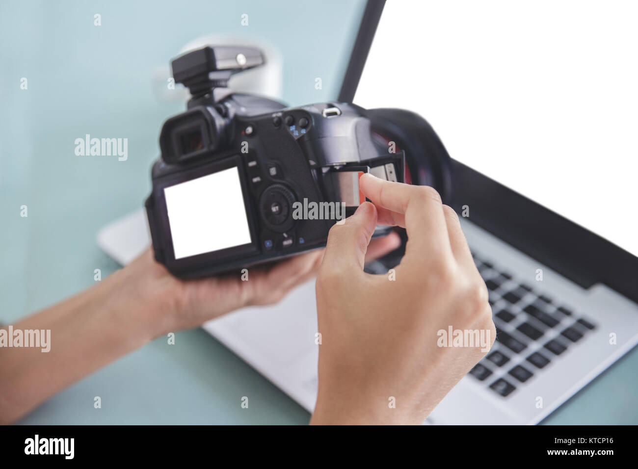 hand of photographer inserting the memory card to the camera Stock ...