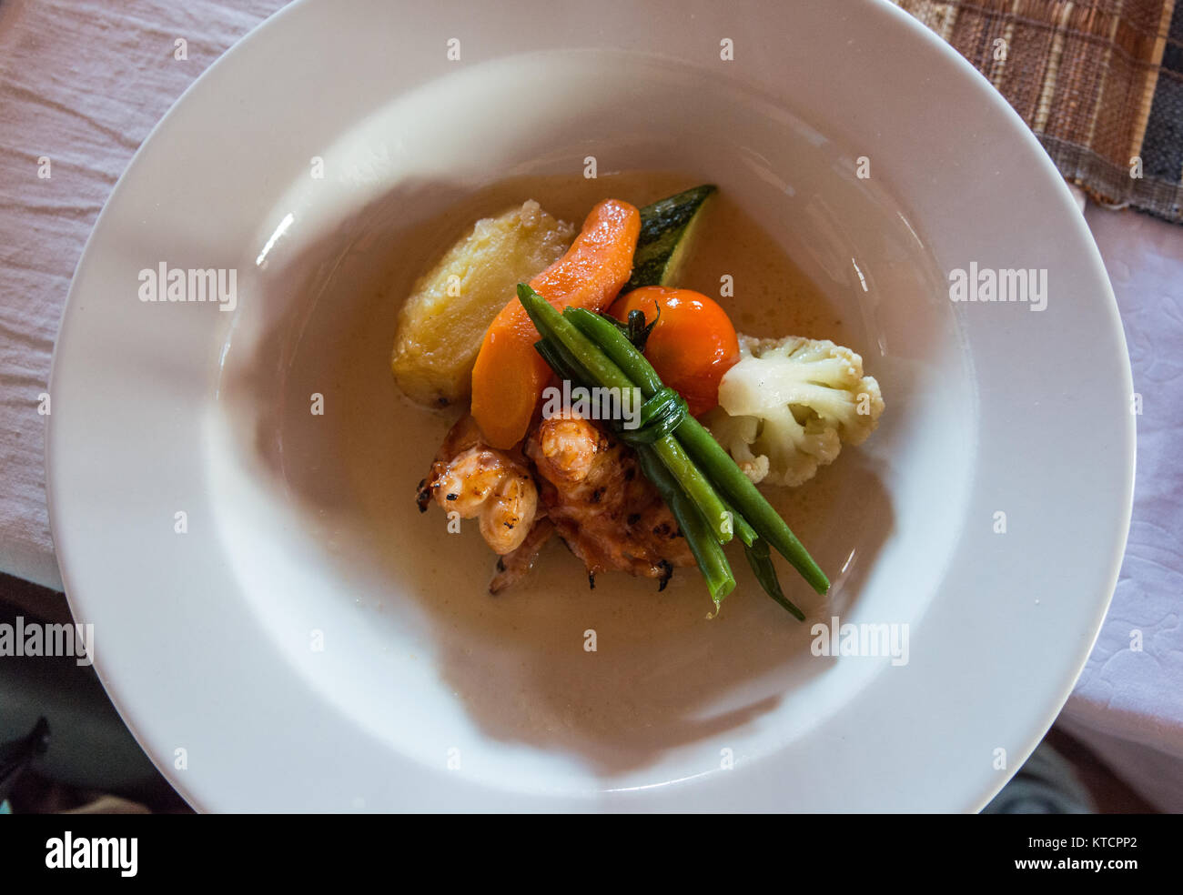 Prawns and vegetables, a well prepared dish served at local restaurant Mad Zebu in Belo, a small town in west Madagascar, Africa. Stock Photo