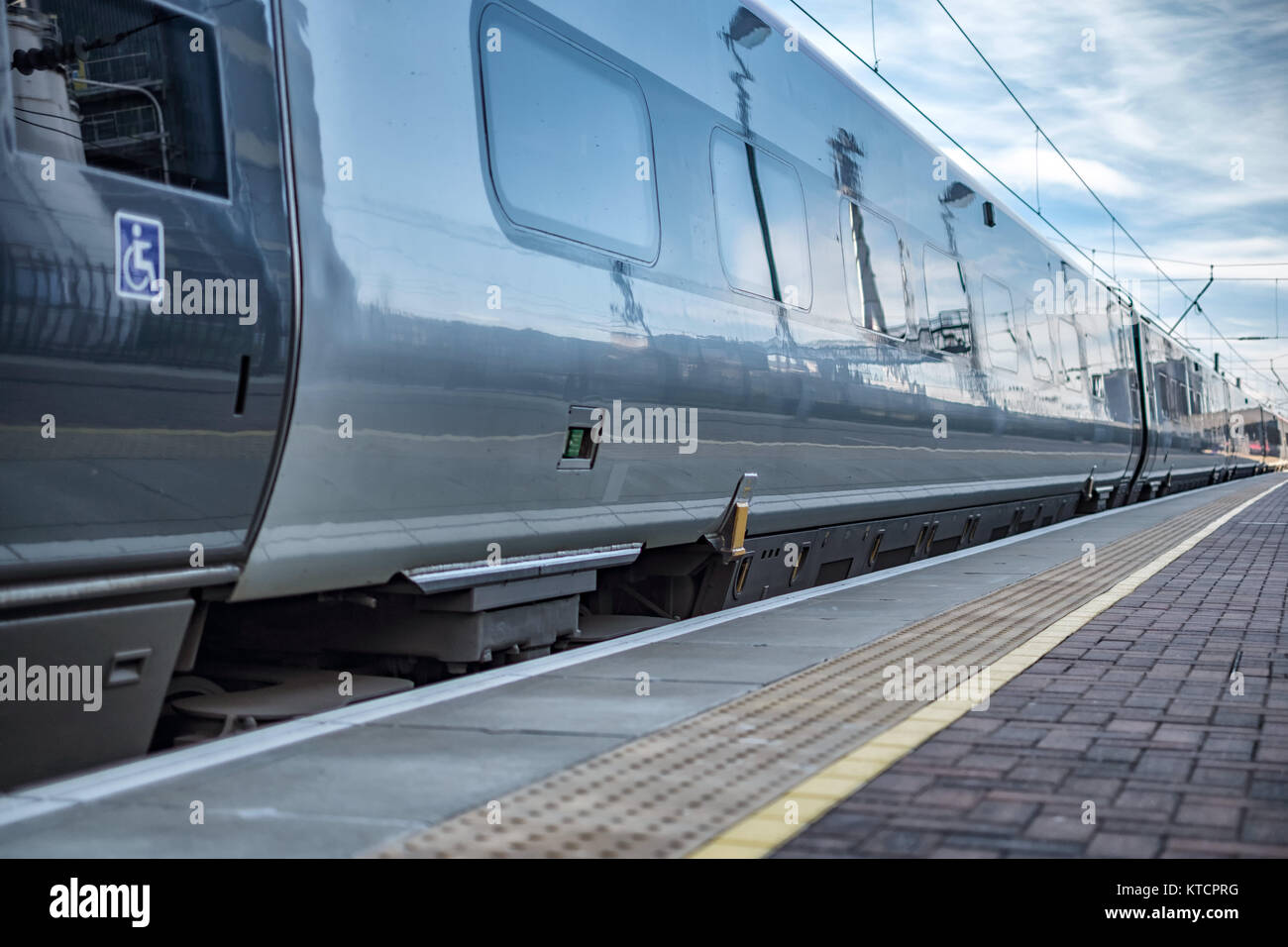 The train leaving platform 3 Stock Photo