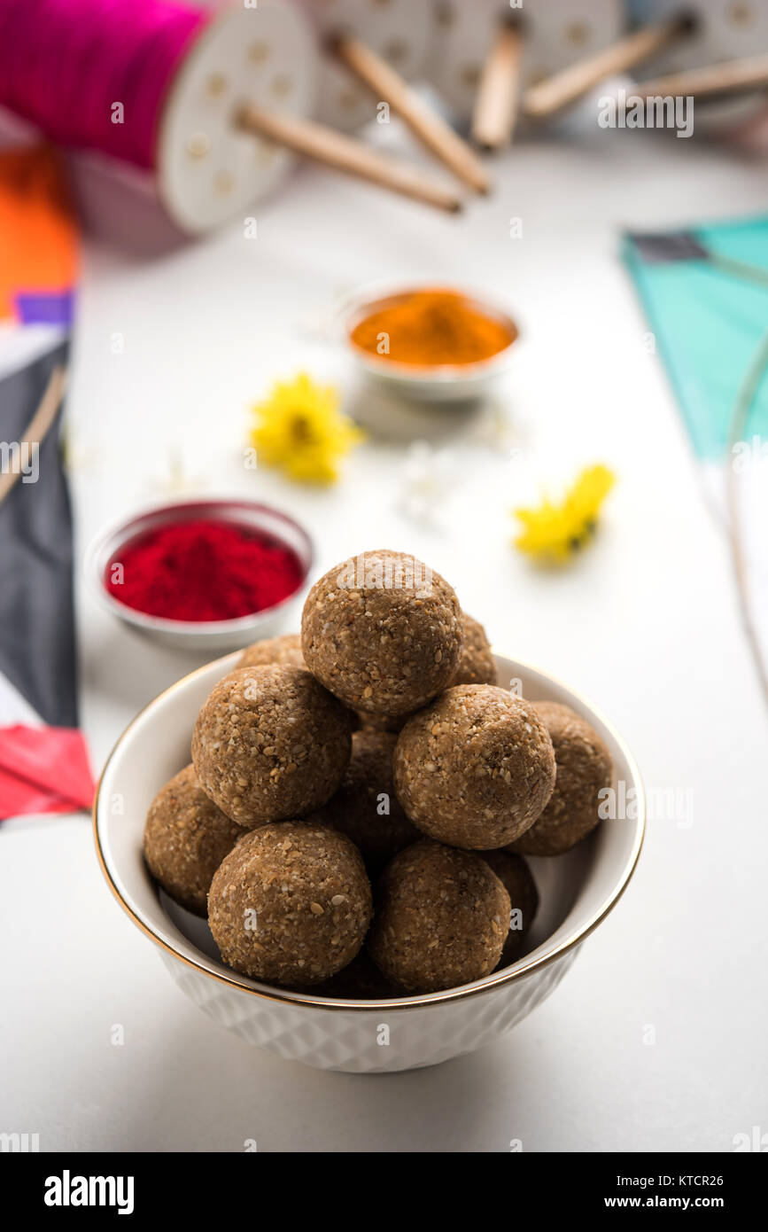 happy Makar Sankranti greeting card - Tilgul or Til ladoo in a ...