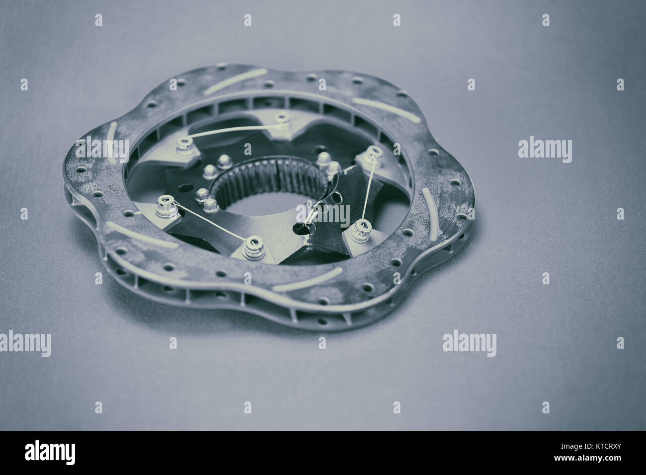 Broken, cracked and warped racing brake rotor Stock Photo Alamy