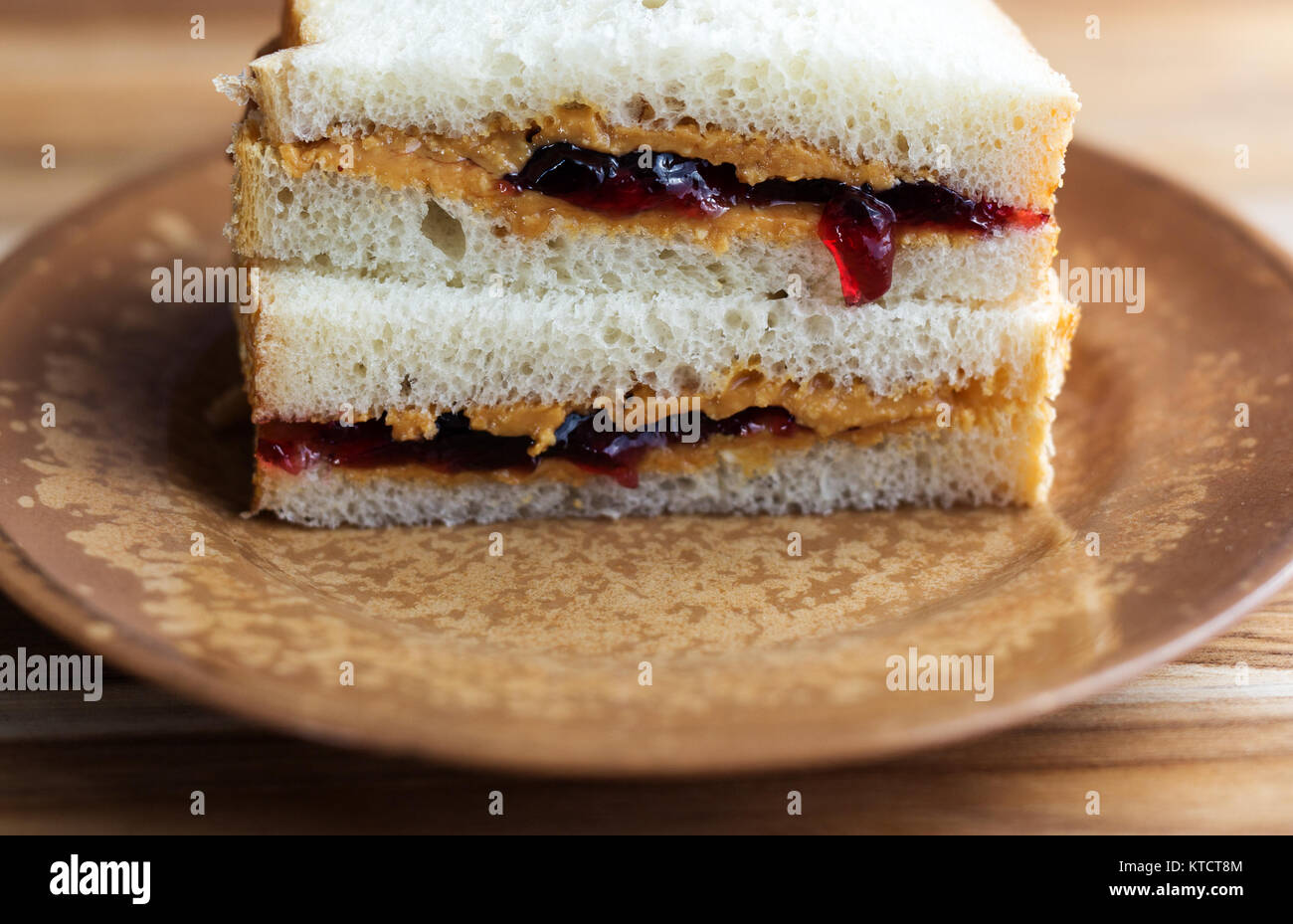 Peanut Butter And Jelly Sandwich On White Bread Cut In Half And Stock Photo Alamy