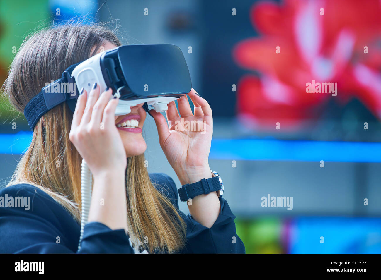 Young woman wearing virtual reality device Stock Photo - Alamy
