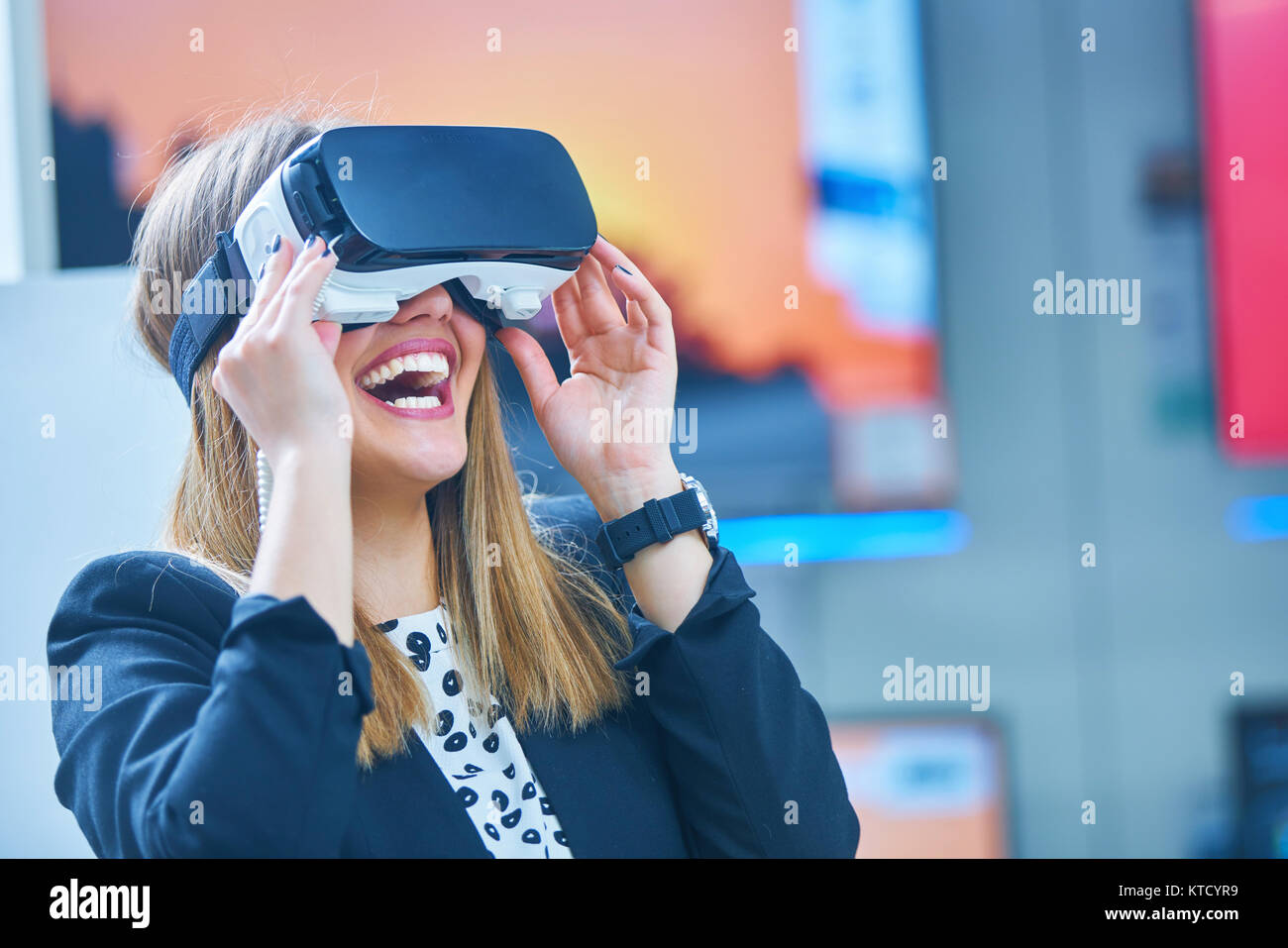 Young woman wearing virtual reality device Stock Photo - Alamy