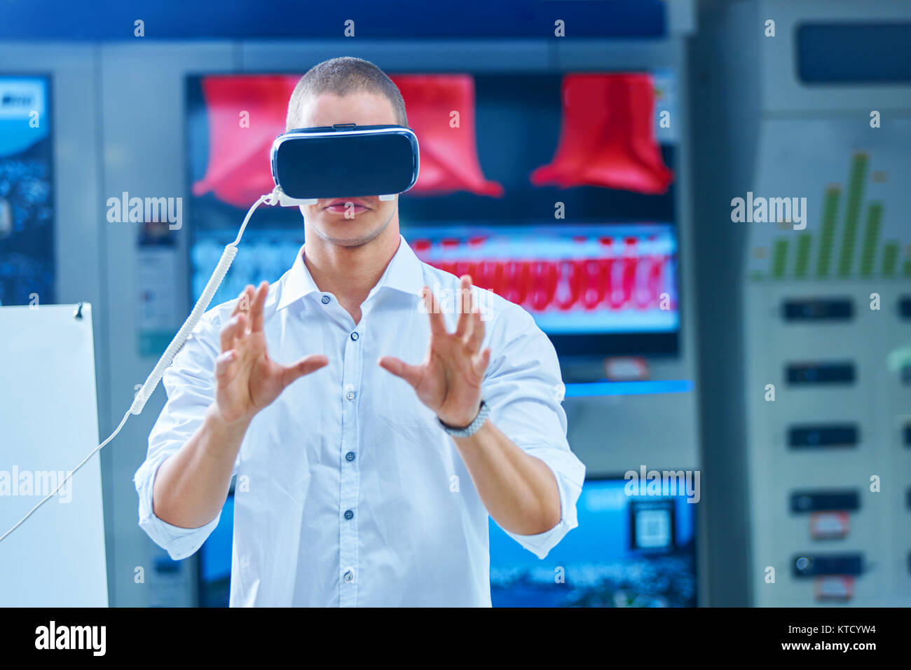 Man wearing virtual reality goggles Stock Photo - Alamy