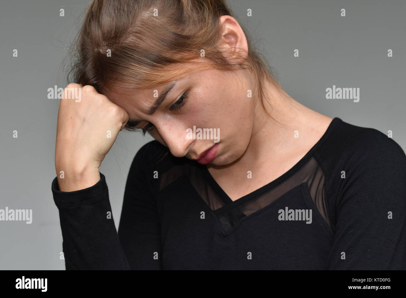 Cute Female Youngster And Sadness Stock Photo