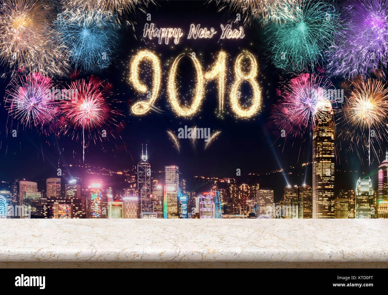 Happy new year 2018 fireworks over cityscape at night with empty marble