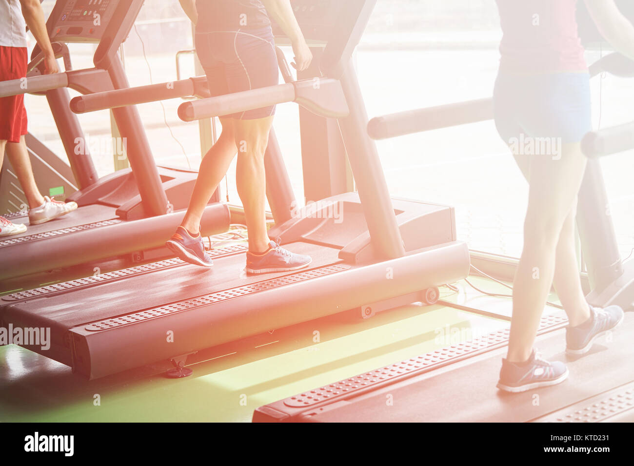 People running in machine treadmill at fitness gym club Stock Photo