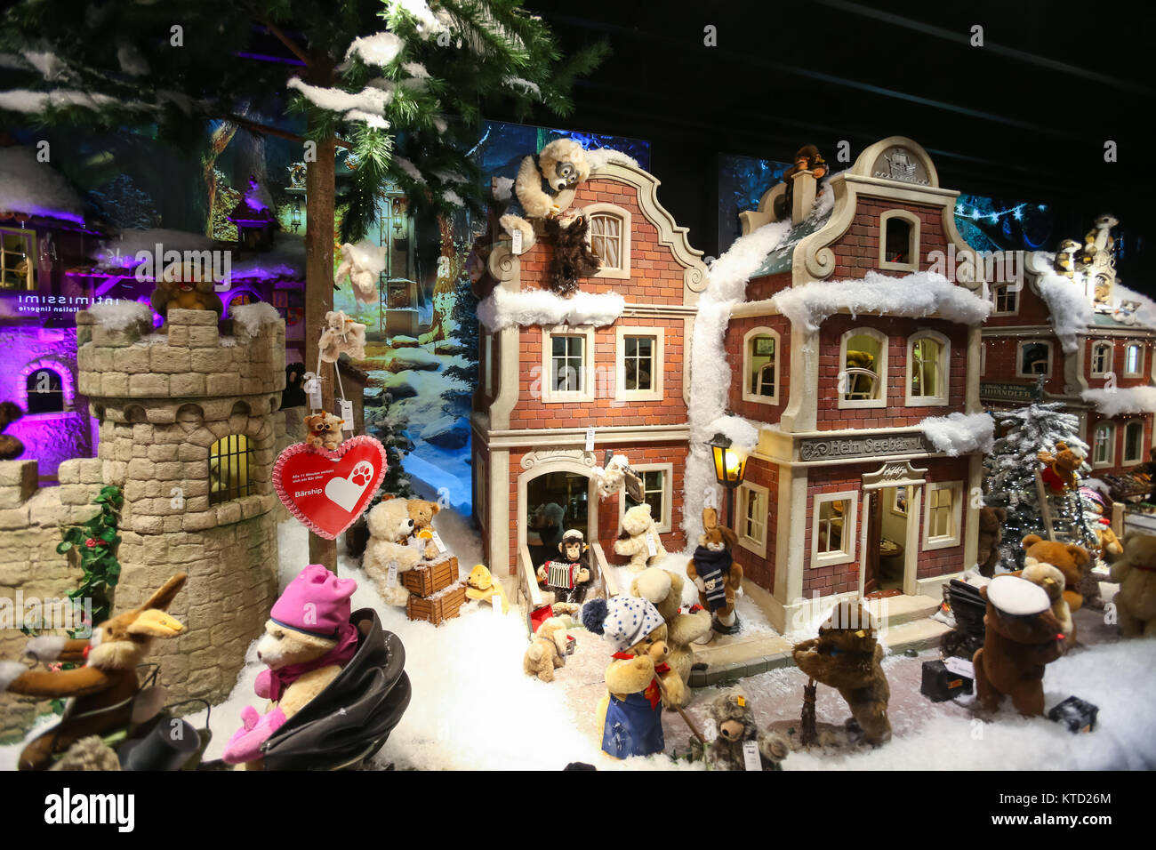MUNICH, GERMANY - DECEMBER 11, 2017 : The shop window of Galeria Kaufhof ornated with toys in winter style at night in Munich, Germany. Stock Photo