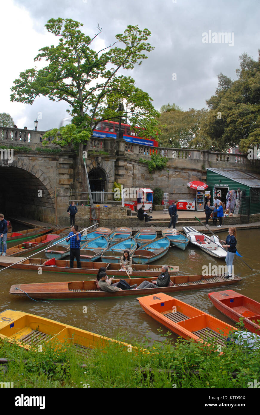 Oxford, United Kingdom - May 10: Colorful punting boats at Magdalen bridge Stock Photo