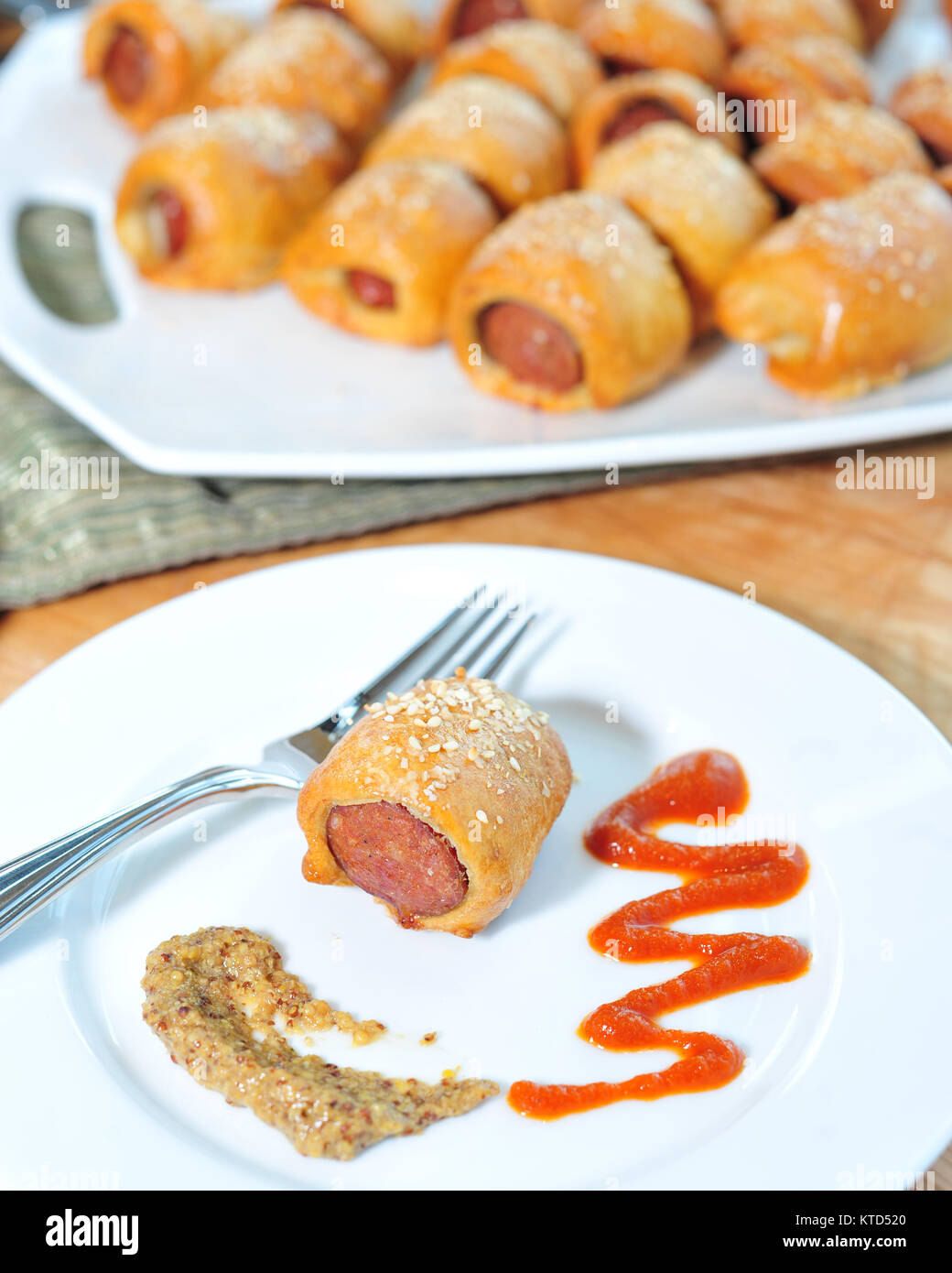 Sausage rolls with mustard Stock Photo Alamy