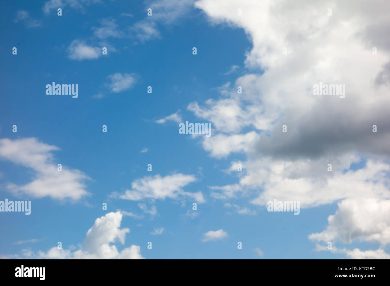 lot of white clouds hanging against the blue sky Stock Photo - Alamy