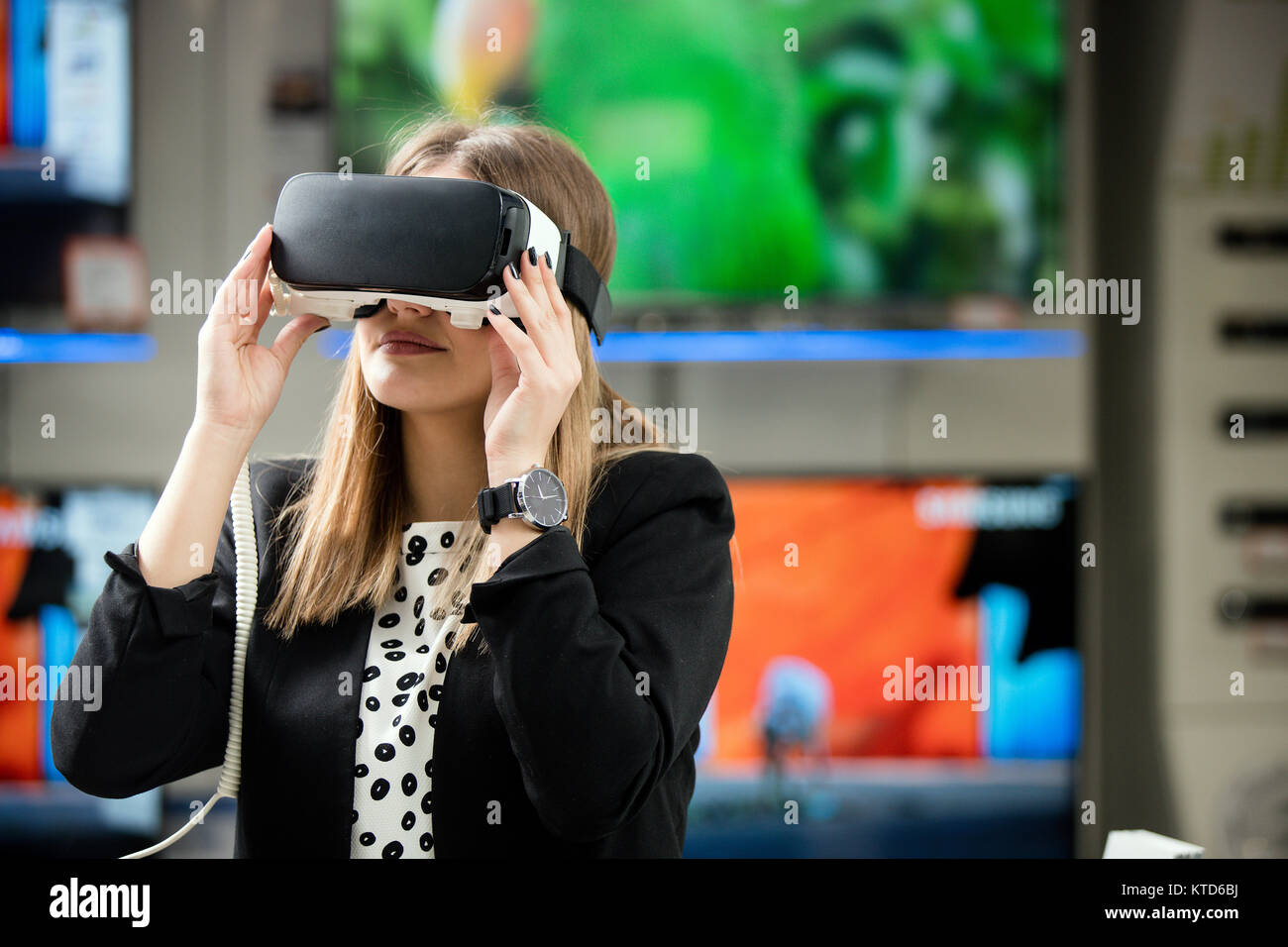 Young woman wearing virtual reality device Stock Photo - Alamy
