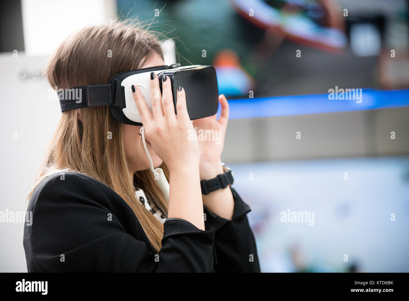 Young woman wearing virtual reality device Stock Photo - Alamy