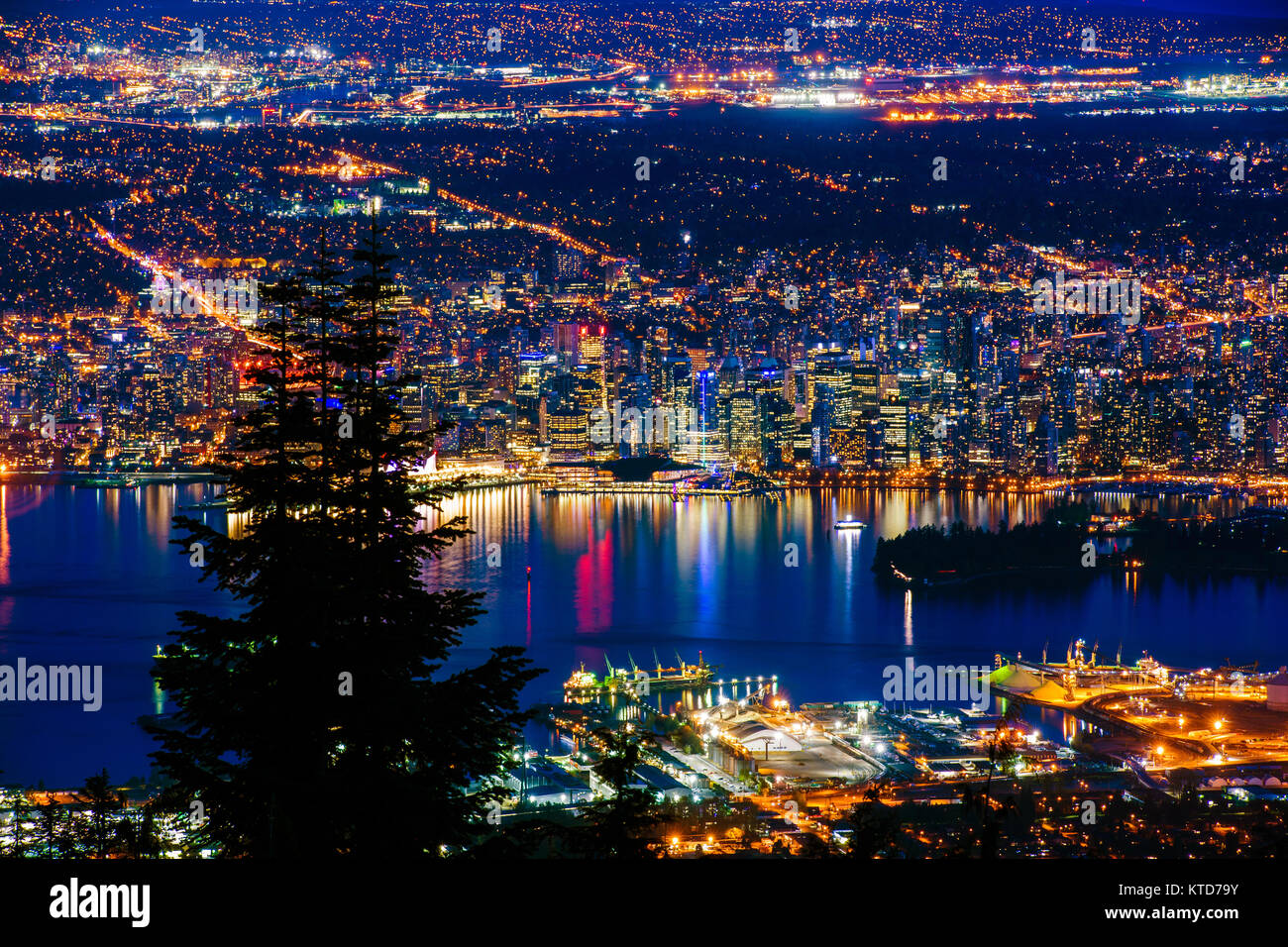 Aerial view of Vancouver city by night, British Columbia, Canada. Photographed from the top of the Grouse Mountain. Stock Photo