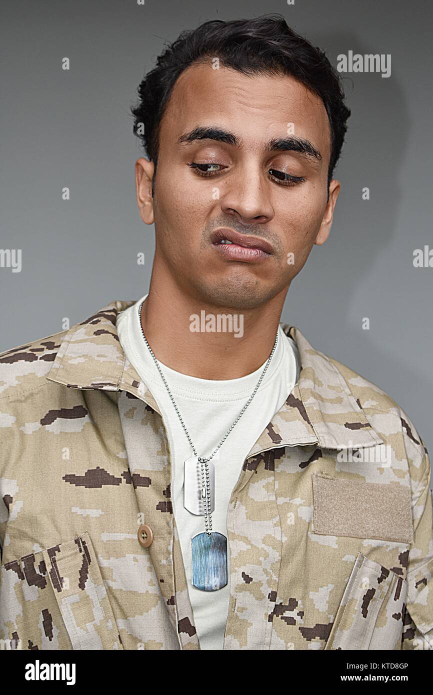 Young Colombian Male Soldier And Confusion Stock Photo