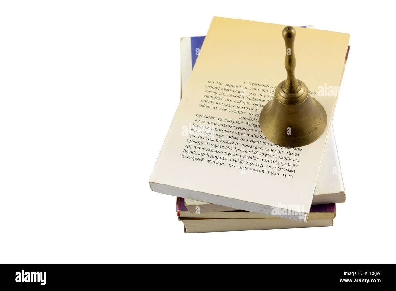 old bell with stack of books Stock Photo