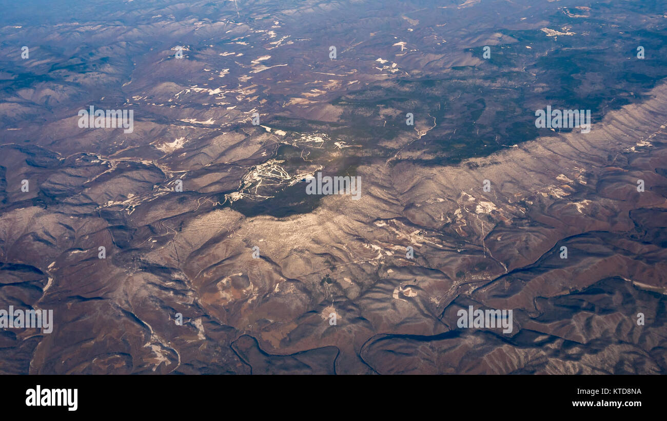 Aerial Picture of Small Town Next to Mountains Stock Photo