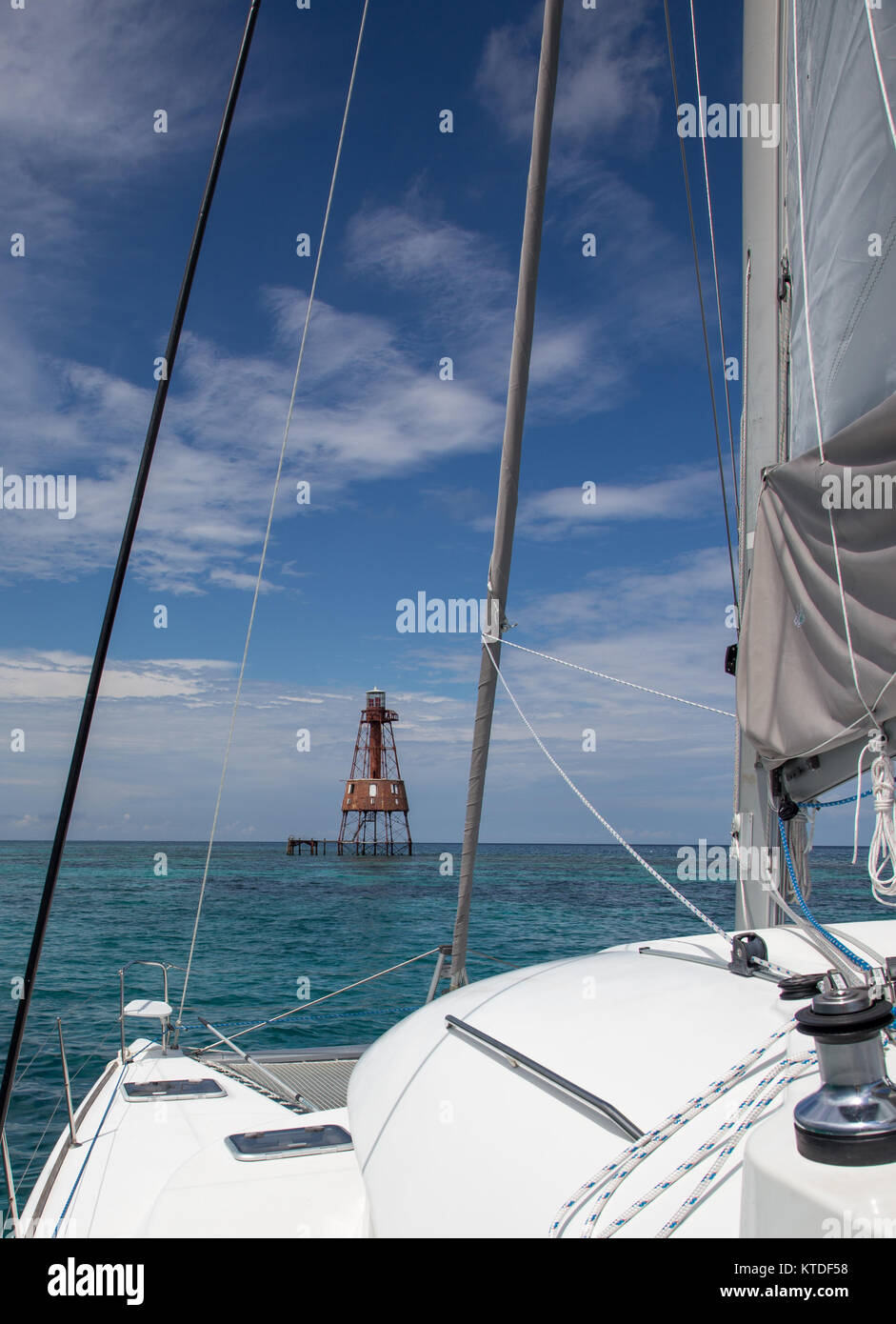 Florida Keys - Charter catamaran sails to offshore lighthouse Stock Photo