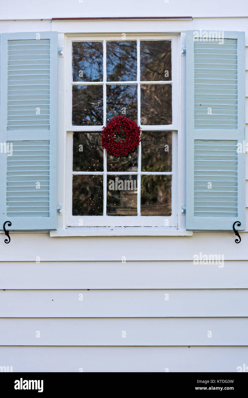 A Low Country Popcorn Berry Christmas Wreath Hangs From A