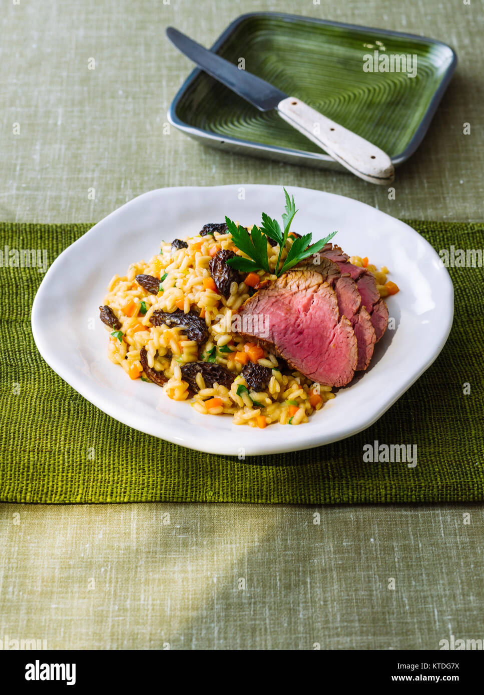 Risotto with morels and veal fillet Stock Photo Alamy