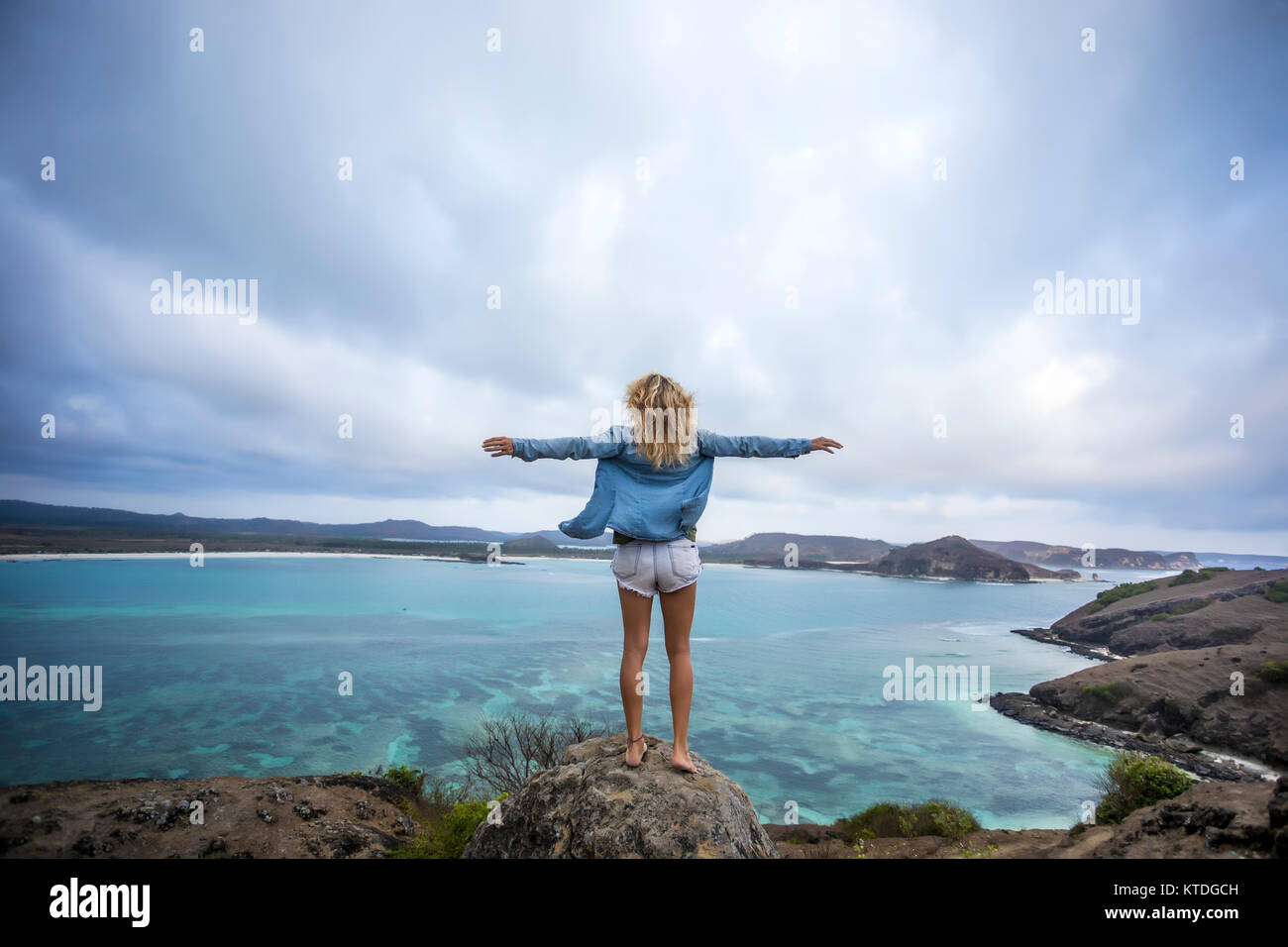Rear view blond woman raising hi-res stock photography and images - Alamy