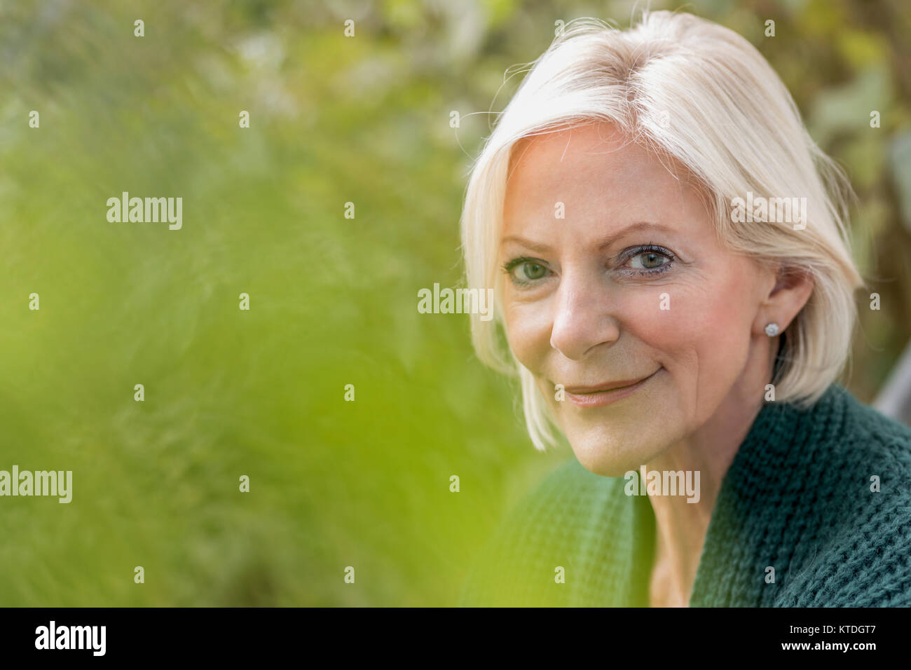 Portrait of smiling senior woman in nature Stock Photo - Alamy