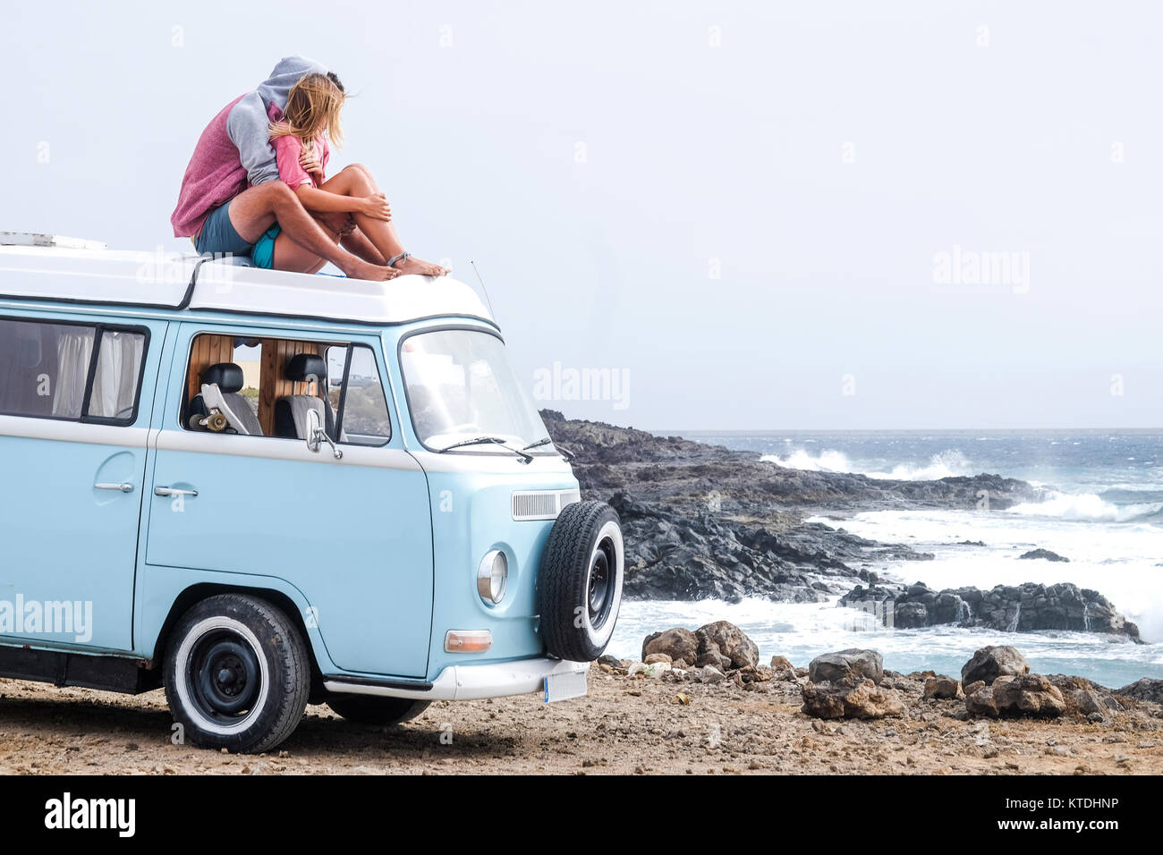 Spain, Tenerife, young couple in love relaxing on car roof of van Stock  Photo - Alamy