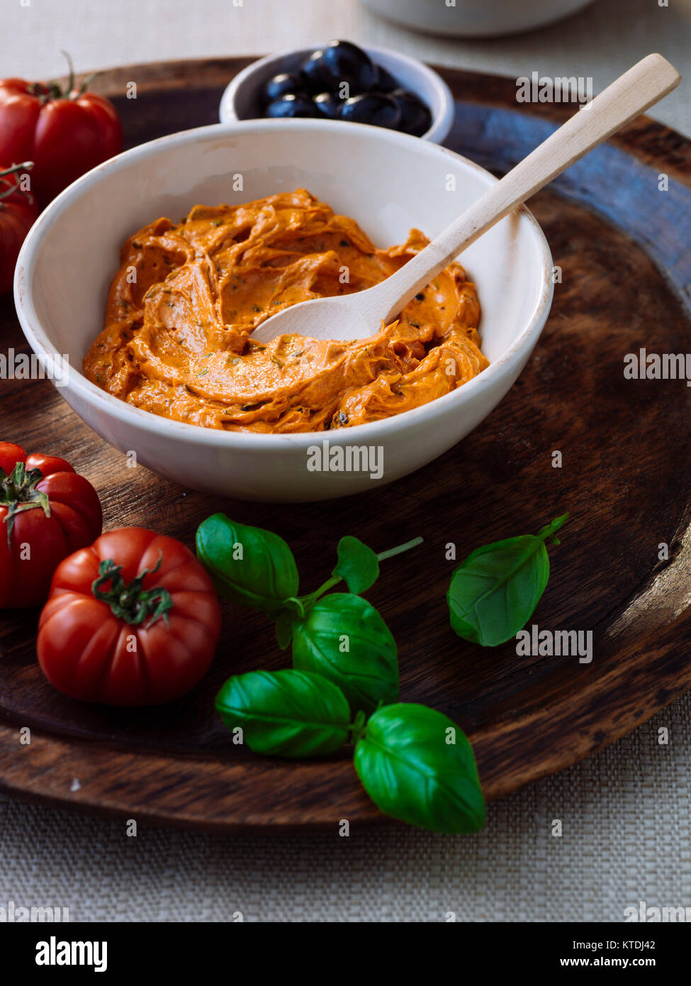 Herb butter with tomatoes and basil Stock Photo Alamy