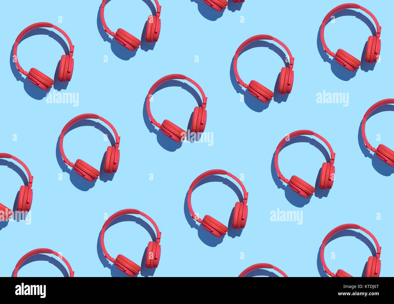 Collection of red wireless headphones on light blue background, 3D Rendering Stock Photo