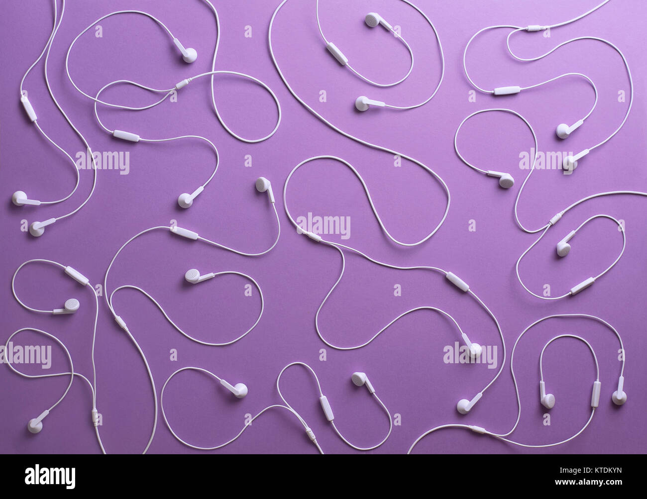 White earphones on purple background, 3D Rendering Stock Photo