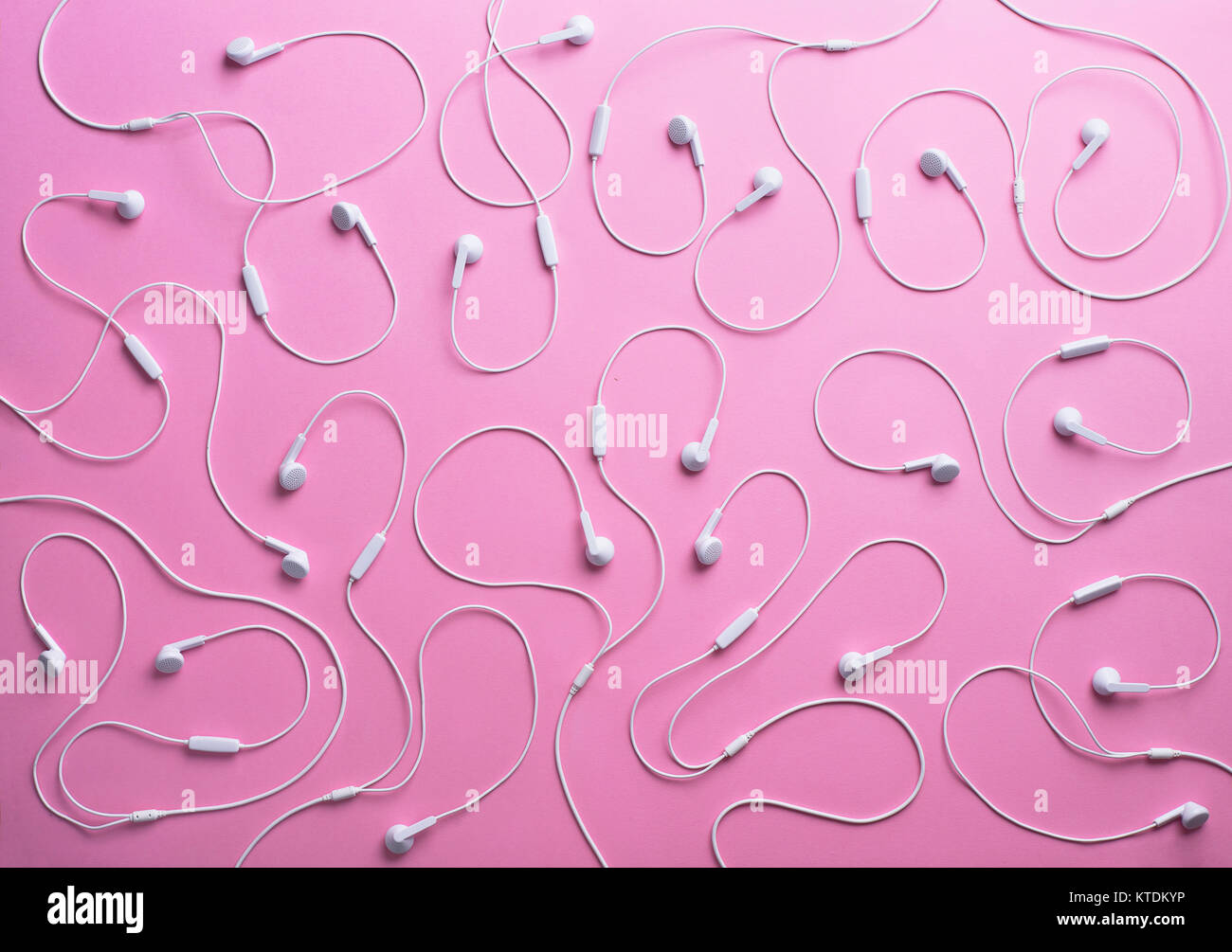 White earphones on pink background, 3D Rendering Stock Photo