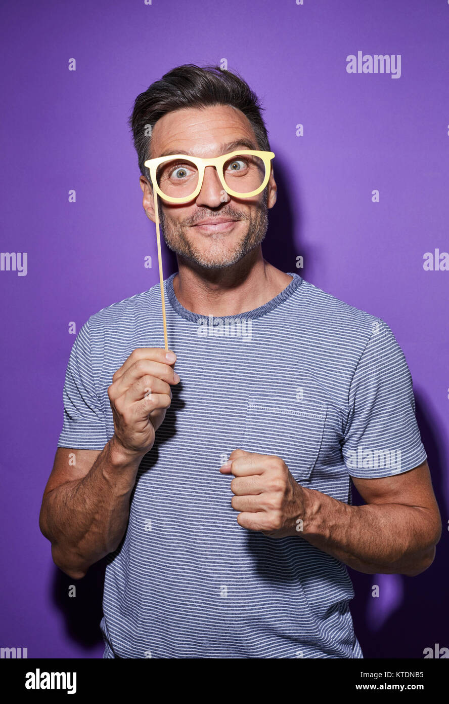 Portrait of starring man with comedy glasses Stock Photo