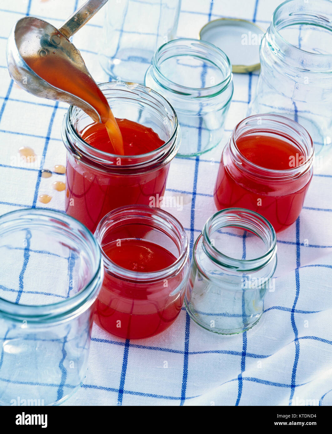 Pouring plum jam into jars Stock Photo Alamy