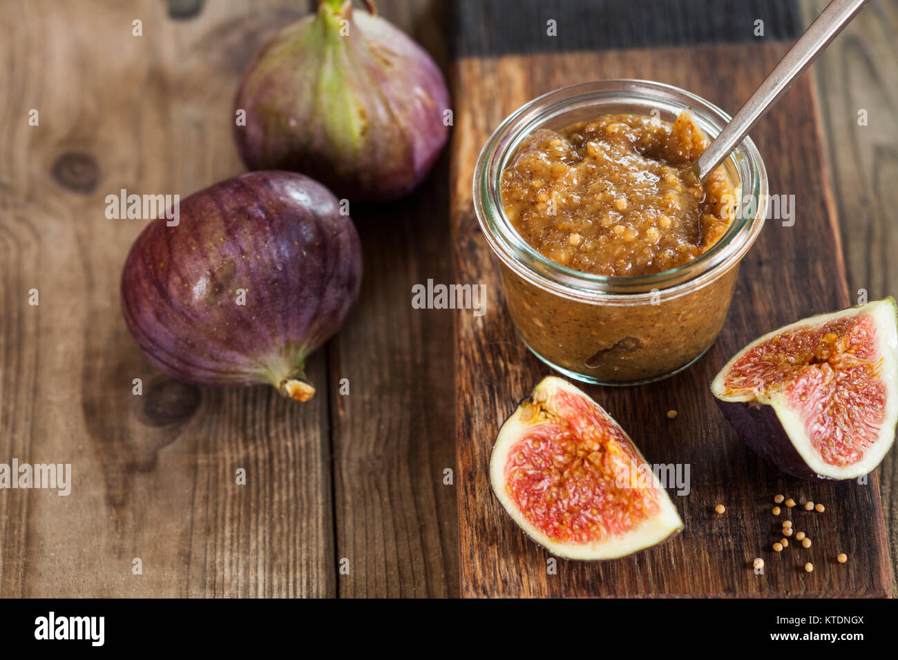 Glass of fig mustard Stock Photo Alamy