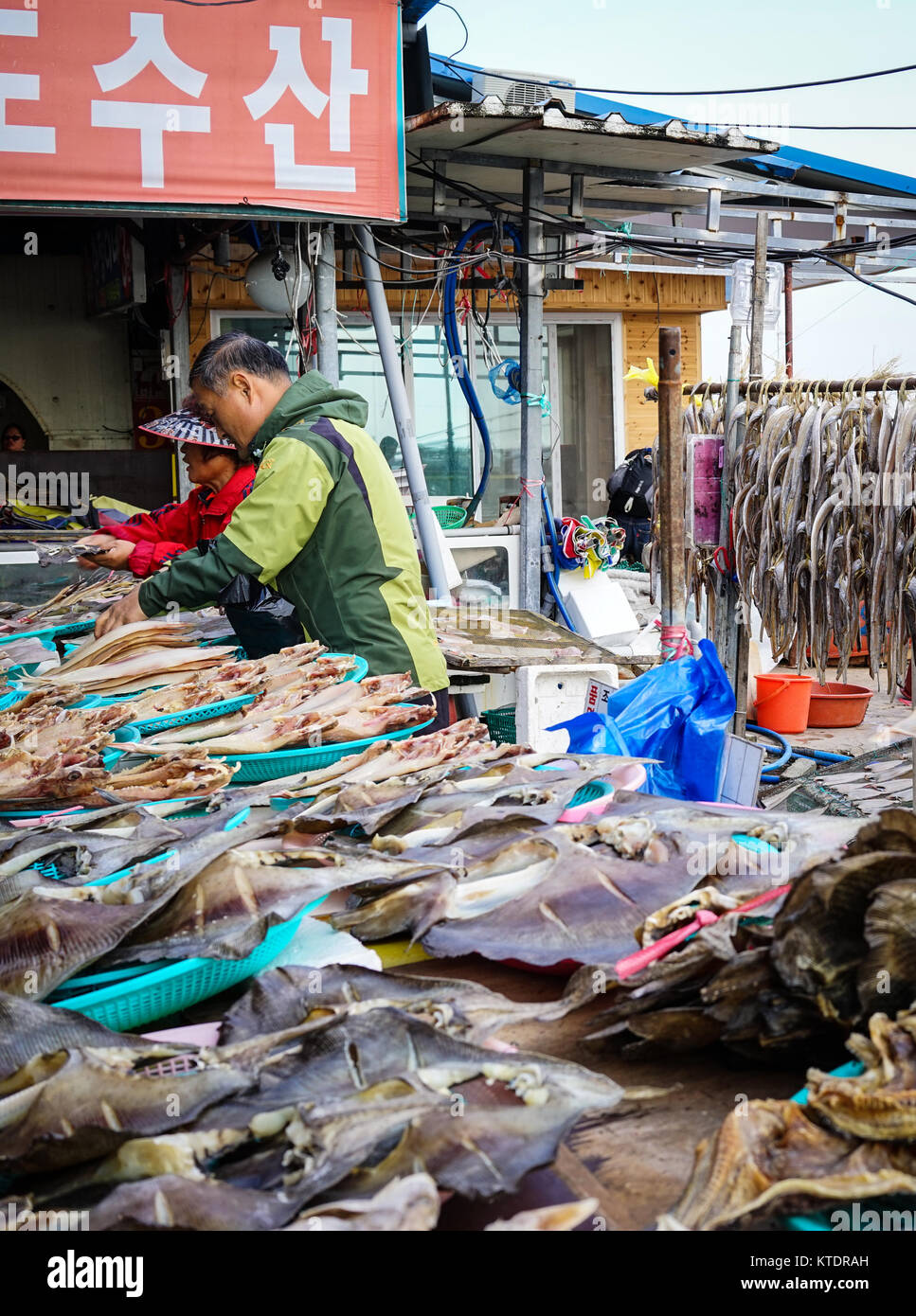 Busan, Korea - Nov 2, 2014. People making dried fish at the local village in Busan, Korea. Busan (Pusan) is Korea second largest city with close to 4  Stock Photo