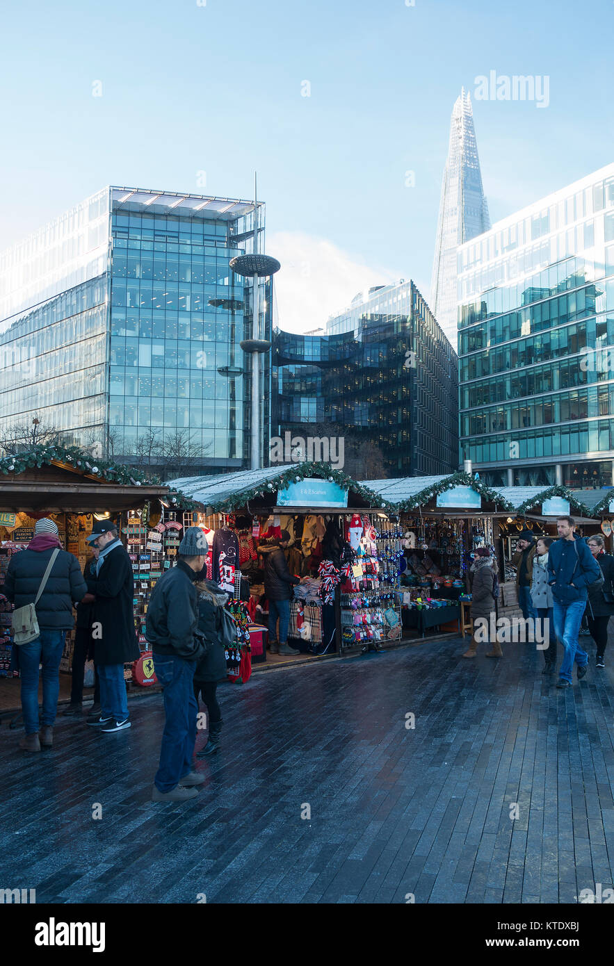 Christmas Market Stalls with The Shard Skyscraper and Modern Office Buildings on the South Bank River Thames London England United Kingdom UK Stock Photo