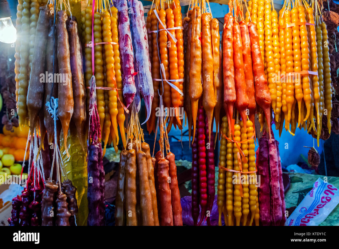 Traditional churchkhela made of nuts and dried fruits dipped