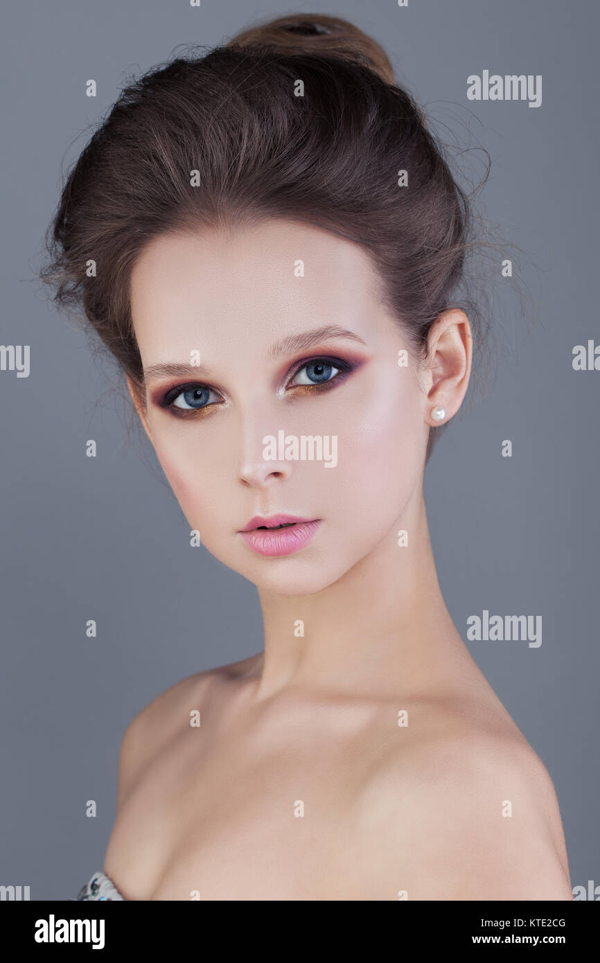 Young Woman on Blue Background Stock Photo - Alamy