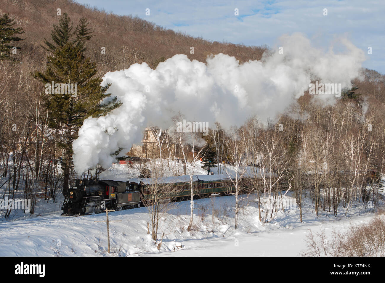 Steam train in snowy countryside Stock Photo