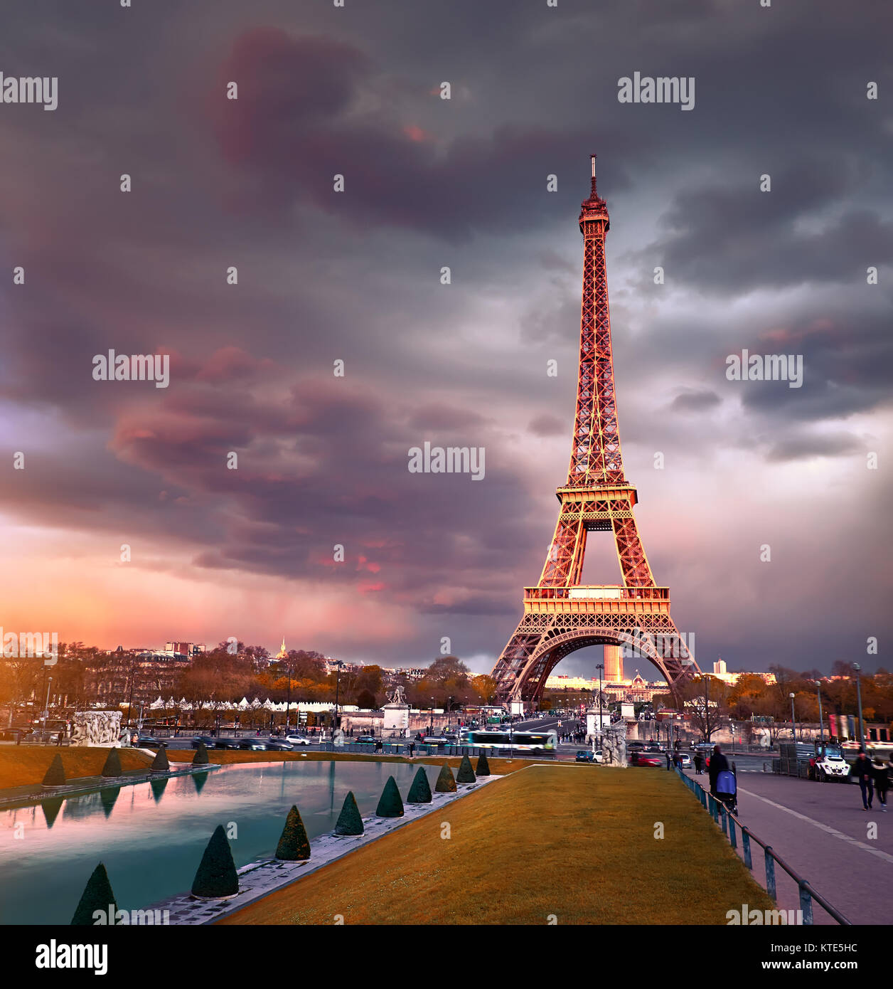 Eiffel tower on a sunset half-lit with last rays of the setting Sun. Panoramic toned image. Stock Photo