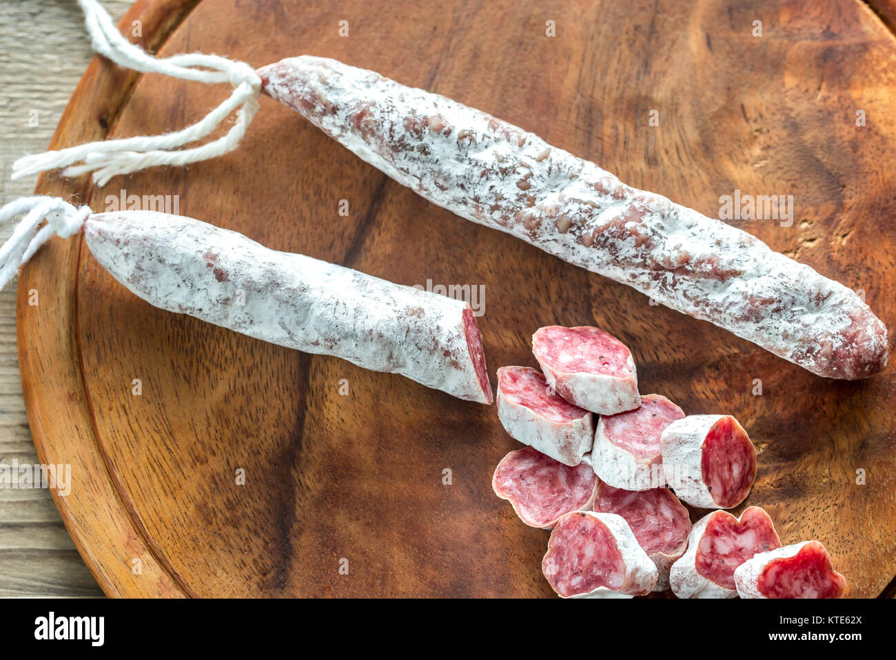 Spanish fuet on the wooden board Stock Photo Alamy